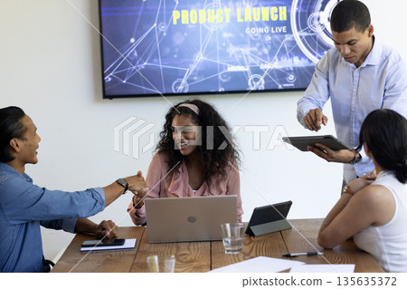 Diverse business team collaborating on product launch presentation in modern office 135635372