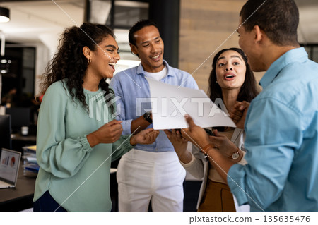 Diverse business team discussing project and sharing ideas in modern office Diverse business team discussing project and sharing ideas in modern office 135635476