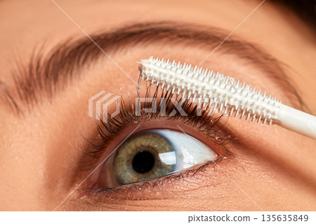 Mascara primer applicator coating long eyelashes and eyelid 135635849