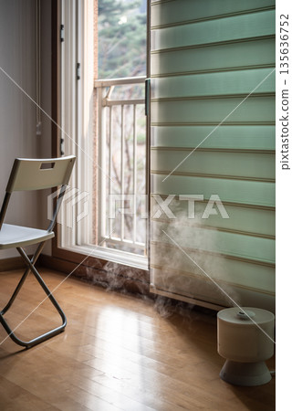 Cozy Room with Chair and Humidifier by Open Balcony Door 135636752
