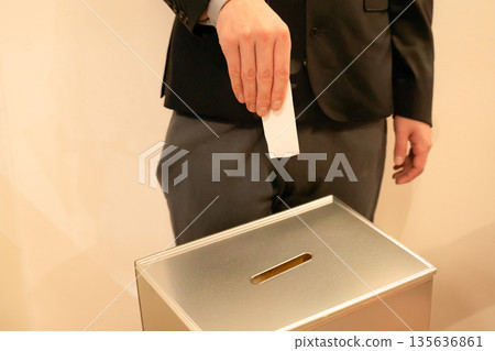 Male hand voting Male hand voting 135636861