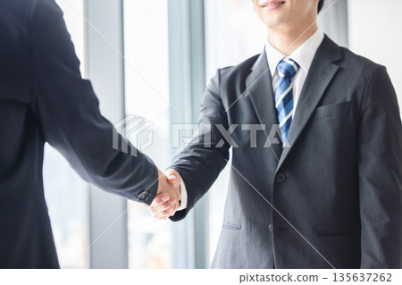A businessman shaking hands A businessman shaking hands 135637262