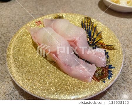 Nigiri sushi topped with sashimi of Tsuji no mi (Fuji Hachime). 135638133