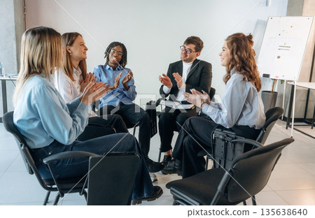 Applauding together. People are in group psychological support room Applauding together. People are in group psychological support room 135638640