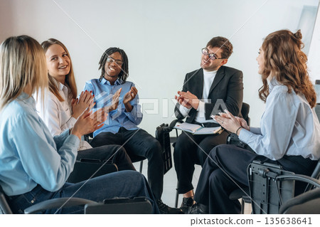 Applauding together. People are in group psychological support room Applauding together. People are in group psychological support room 135638641