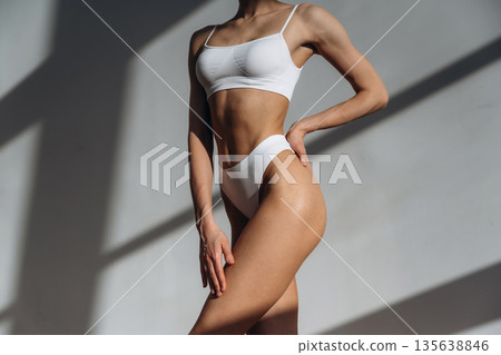 Clean skin. Close up view of woman with slim body type indoors 135638846