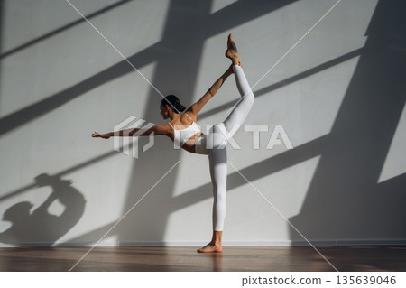 Athletic slim body type. Beautiful young woman is indoors Athletic slim body type. Beautiful young woman is indoors 135639046