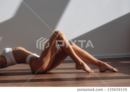 Diet conception. Close up view of woman with slim body type indoors Diet conception. Close up view of woman with slim body type indoors 135639159