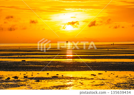 Golden sunrise above the ocean at Sapanhin viewpoint Phuket Golden sunrise above the ocean at Sapanhin viewpoint Phuket 135639434