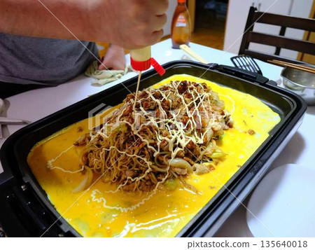 Cooking Yakisoba at a food stall Cooking Yakisoba at a food stall 135640018