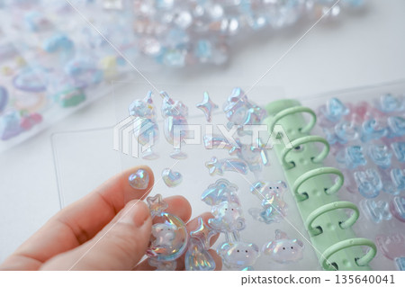 Sticking the popular Bonbon Drop stickers into a sticker book Sticking the popular Bonbon Drop stickers into a sticker book 135640041