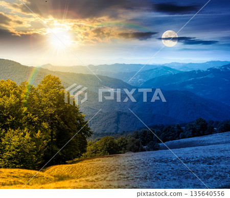 beautiful mountain landscape with beech trees on rolling hills. day and night time change concept. scenic view of alpine countryside scenery with sun and moon at twilight. equality and shift template 135640556