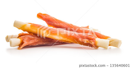 Dog food. Snack sticks for dogs isolated on white background. 135640601