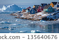 Polar Village with Bright Houses and Floating Icebergs 135640676
