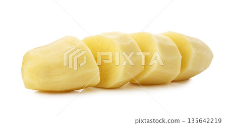 Raw potatoes cut into pieces isolated on a white background 135642219