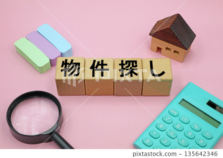 A block with the words "Searching for a Property" written on it A block with the words "Searching for a Property" written on it 135642346