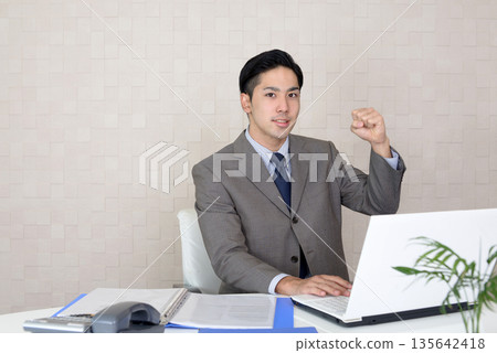 Businessman doing desk work Businessman doing desk work 135642418
