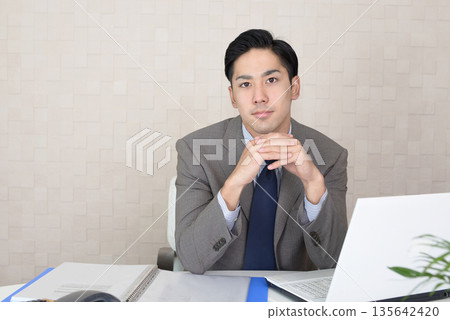 Businessman doing desk work 135642420