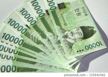 Pile of Korean banknote money. Pile of Korean banknote money. 135642482