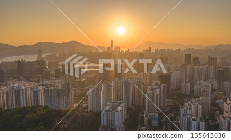 Jan 11 2026 Golden Sunset Over Kowloon Skyline and Victoria Harbour View 135643036