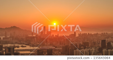Jan 11 2026 Golden sunset illuminating Hong Kong vibrant Kowloon Peninsula skyline Jan 11 2026 Golden sunset illuminating Hong Kong vibrant Kowloon Peninsula skyline 135643064