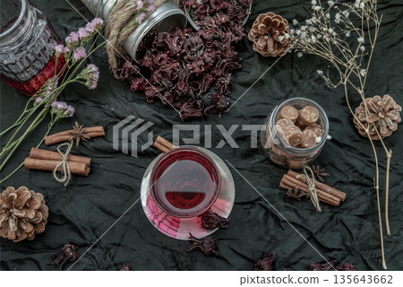 Roselle tea (Jamaica sorrel, Rozelle or hibiscus sabdariffa ) with dry roselle and brown cane sugar cube. Roselle tea (Jamaica sorrel, Rozelle or hibiscus sabdariffa ) with dry roselle and brown cane sugar cube. 135643662
