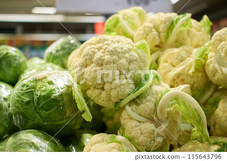 Exploring fresh vegetables at a local market during the morning hours in vibrant city life 135643796