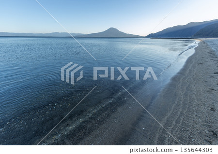 View of Kinko Bay and Sakurajima from Shigetomi Beach in Aira City, Kagoshima Prefecture View of Kinko Bay and Sakurajima from Shigetomi Beach in Aira City, Kagoshima Prefecture 135644303