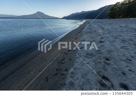 View of Kinko Bay and Sakurajima from Shigetomi Beach in Aira City, Kagoshima Prefecture View of Kinko Bay and Sakurajima from Shigetomi Beach in Aira City, Kagoshima Prefecture 135644305