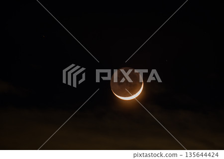 Crescent moon hidden in the clouds Crescent moon hidden in the clouds 135644424