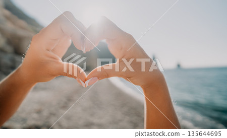 Heart Shaped Hands Against the Sun Heart Shaped Hands Against the Sun 135644695