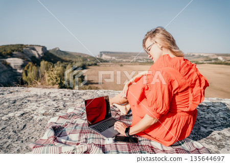 Woman Working on Laptop in Nature 135644697