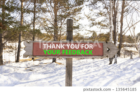 Thank you for your feedback symbol. Concept words Thank you for your feedback on beautiful wooden road sign. Beautiful winter forest background. Business thank you for your feedback concept Copy space 135645185