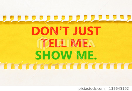 Tell or show symbol. Concept words Do not just tell me, show me on beautiful yellow paper. Beautiful white paper background. Business tell or show concept. Copy space. 135645192