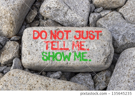 Tell or show symbol. Concept words Do not just tell me, show me on beautiful grey stone. Beautiful grey stones background. Business tell or show concept. Copy space. Tell or show symbol. Concept words Do not just tell me, show me on beautiful grey stone. Beautiful grey stones background. Business tell or show concept. Copy space. 135645235