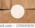 Brown paper texture with white circle sticker 135645650