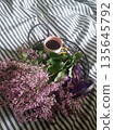Morning Coffee and Lilacs on Striped Bed 135645792