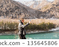 Selfie of man by beautiful turquoise mountain lake 135645806