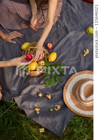 Bright picnic setup, Stylish flatlay with fresh fruits and accessories Bright picnic setup, Stylish flatlay with fresh fruits and accessories 135646021