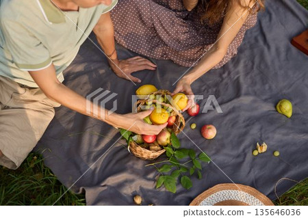 Celebratory outdoor gathering, Shared feast during sunset celebration Celebratory outdoor gathering, Shared feast during sunset celebration 135646036