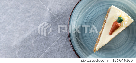 Carrot cake slice with cream cheese frosting 135646160