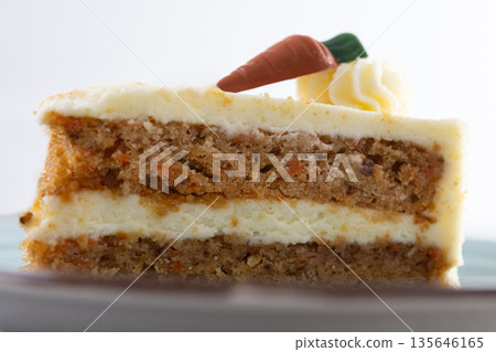 Carrot cake slice with cream cheese frosting Carrot cake slice with cream cheese frosting 135646165