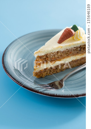 Carrot cake slice with cream cheese frosting Carrot cake slice with cream cheese frosting 135646189