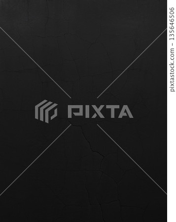 Vertical background image of a dark black-gray concrete wall with vertical and diagonal cracks 135646506
