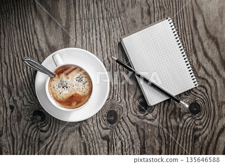 Blank notebook, coffee cup, pencil 135646588