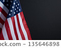 Background for Memorial Day posters, Veterans Day banners, and patriotic holiday designs. American flag on black background with copy space. 135646898