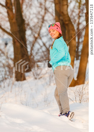 Girl jogging in freezing temperature 135647118