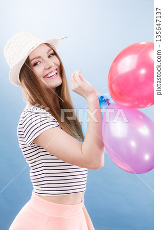 Woman summer joyful girl with colorful balloons Woman summer joyful girl with colorful balloons 135647137