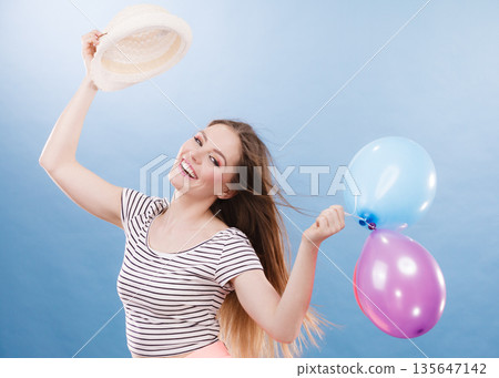 Woman summer joyful girl with colorful balloons Woman summer joyful girl with colorful balloons 135647142
