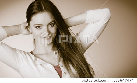 Woman long straight hair vintage portrait 135647474